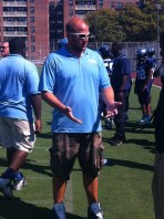 Assistant Coach Chris Sino chats it up to Sidelines during break in action.  