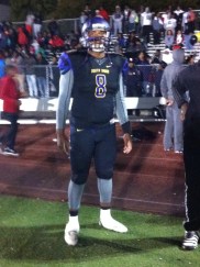 Martin stands on sideline after South Shore coaching staff gives him a break with comfortable lead.