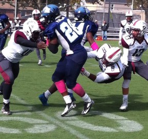 Canarsie tailback Palyte Stubbs sheds tackle for positive yardage.