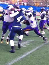 Vikings' offensive line opens hole for running back.