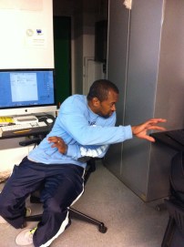 Kyle Allen describing computer program to students.