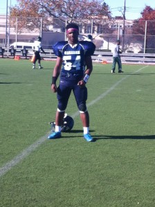 Senior defensive stalwart Devonte Malone, pictured during half time warm-ups, picked up three sacks in the game, tying an all-time Chiefs record with 21.